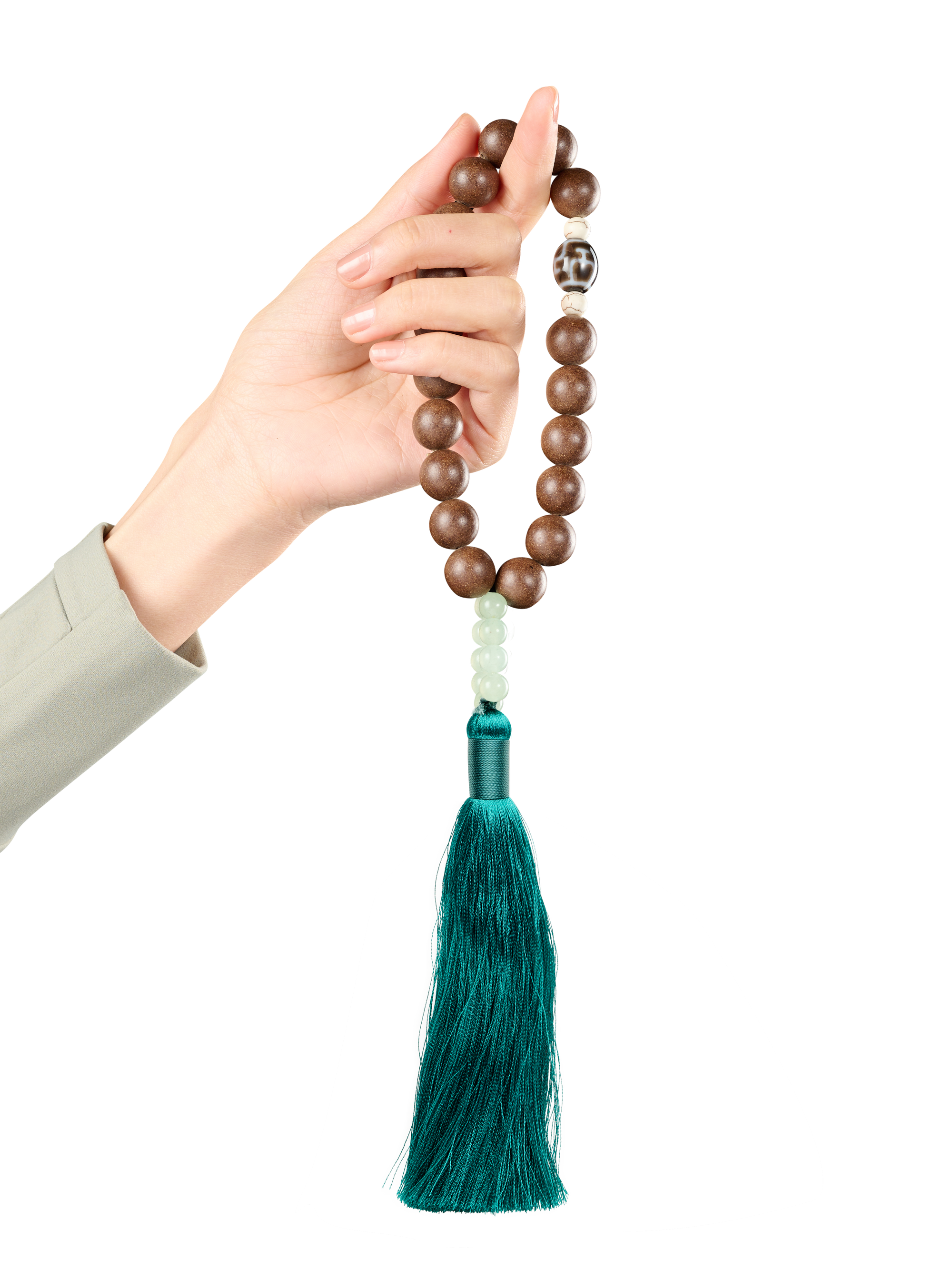 HERIMYST incense bead prayer beads held in hand, featuring natural wood beads with green stone accents and a tassel