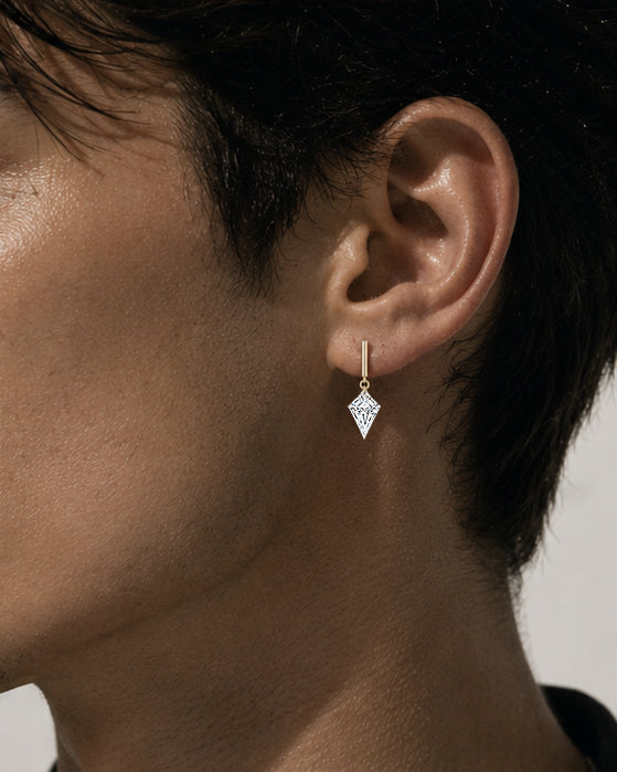 Close-up of a single kite-cut floating diamond drop stud worn on a male model