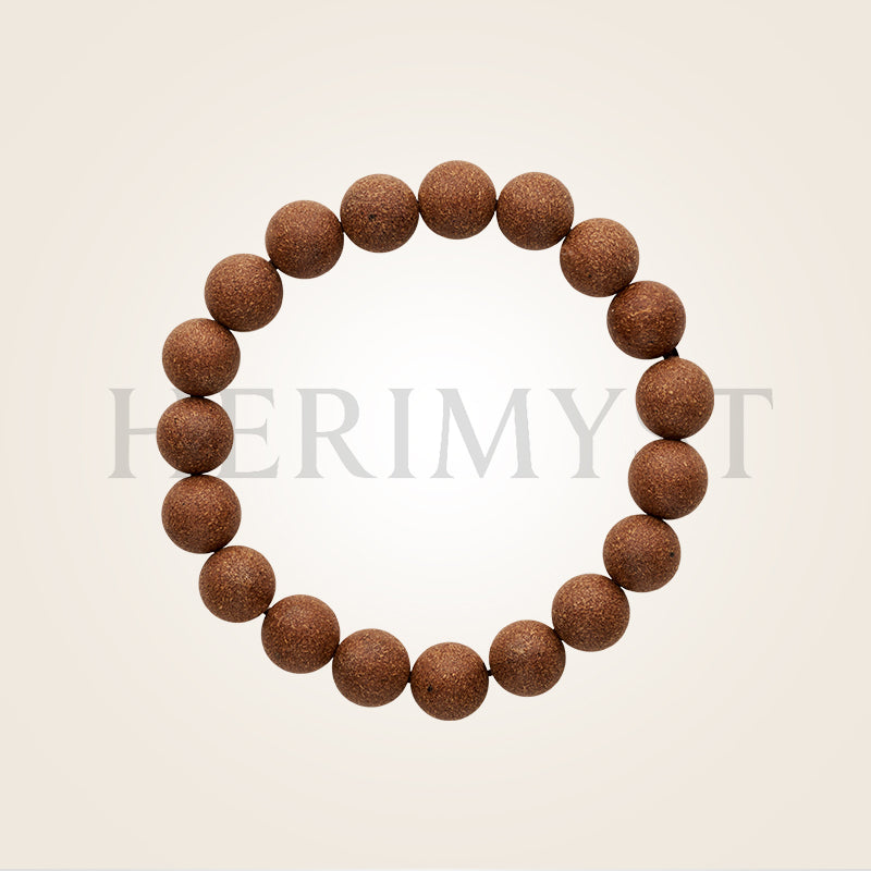 Herimyst Qīng Yán incense bead bracelet from the Grace & Ritual Collection, 10 mm handcrafted fragrance beads in natural wood tone on a neutral background.