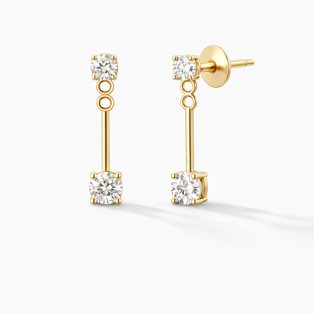 Dual diamond drop stud earrings in 14K yellow gold with lab-grown diamonds on white background