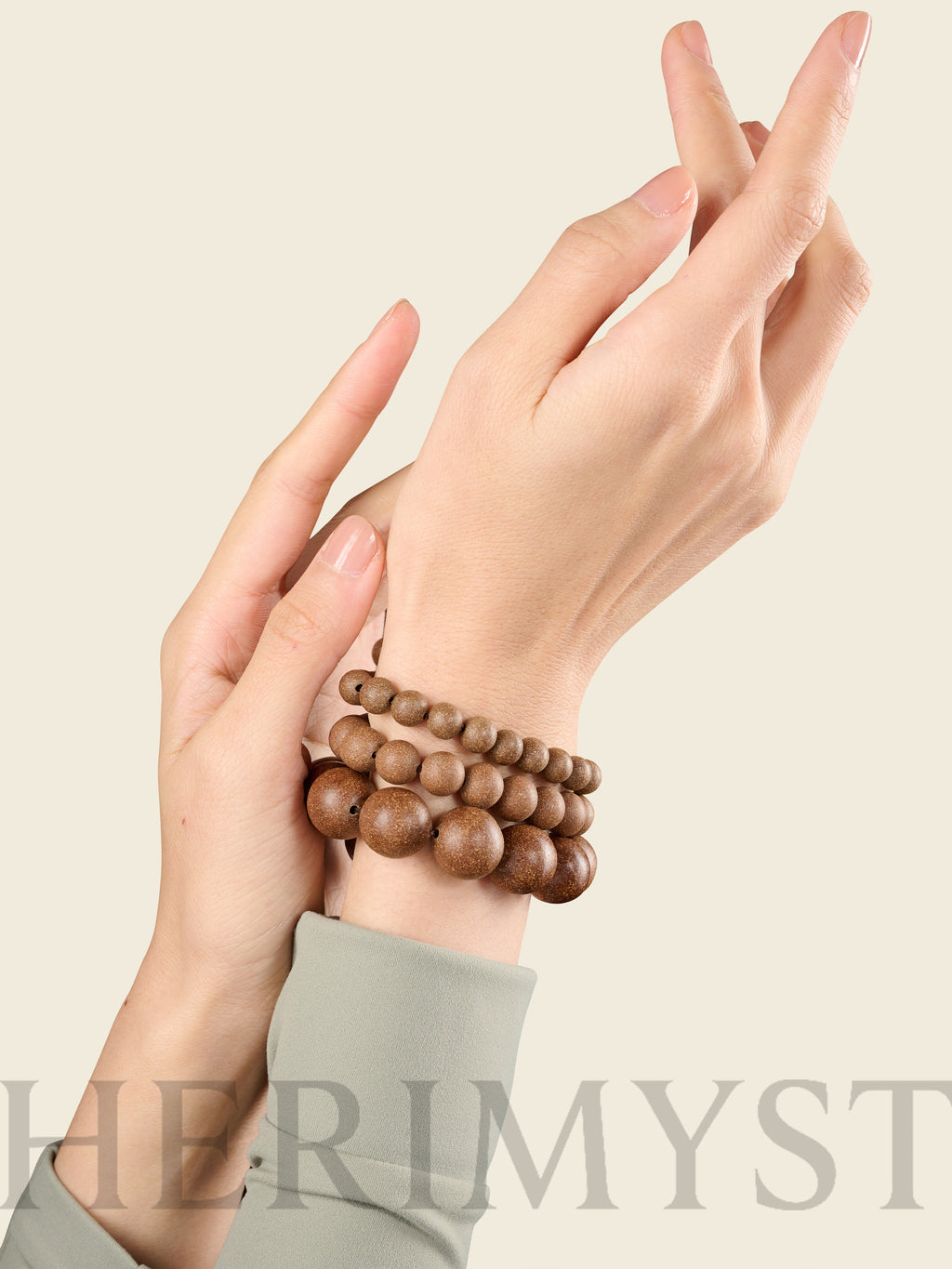 HERIMYST incense bead bracelets worn on wrist, featuring natural wood beads in layered sizes
