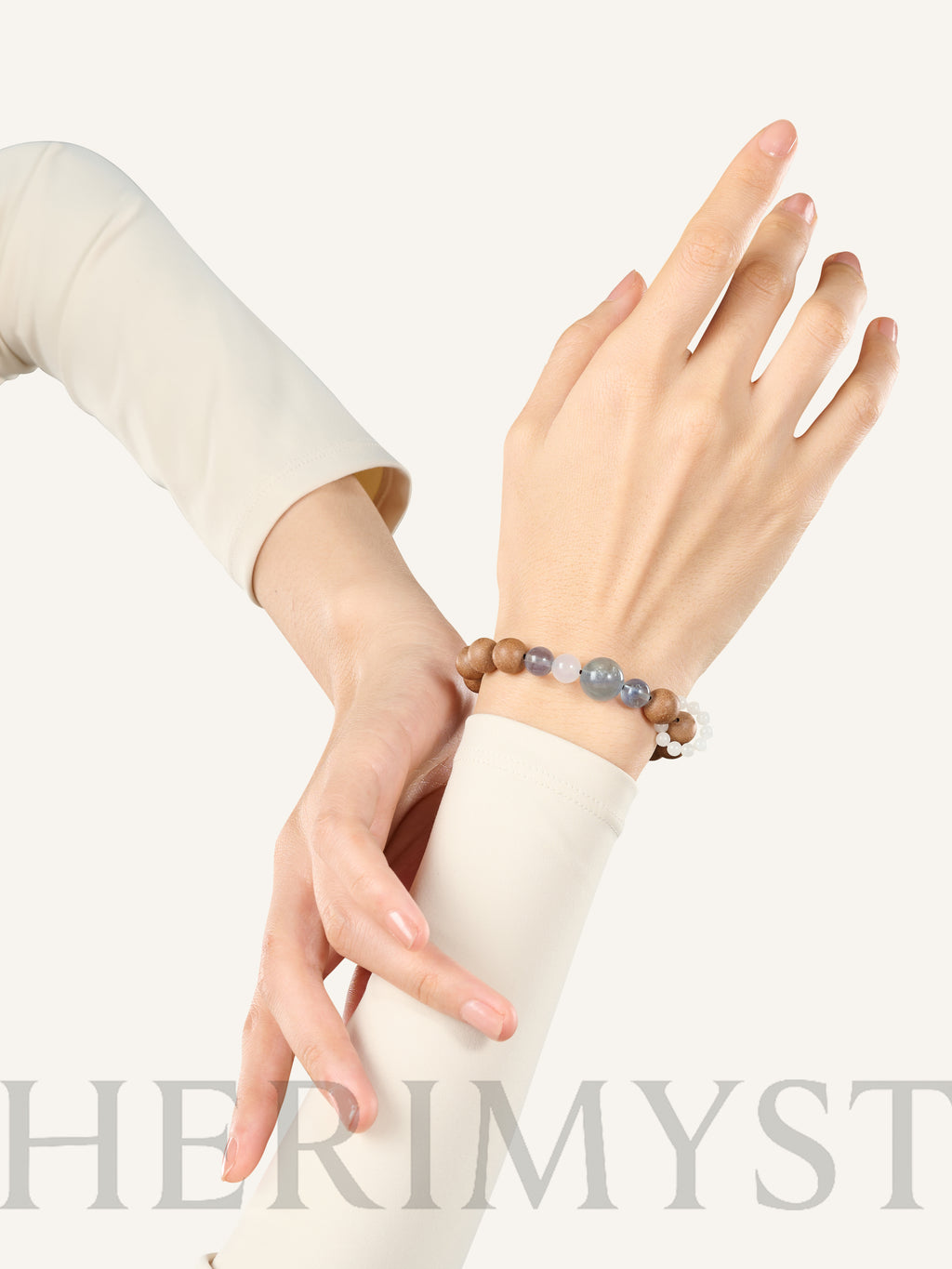 HERIMYST incense bead bracelet worn on wrist, featuring natural wood beads with translucent stone accents