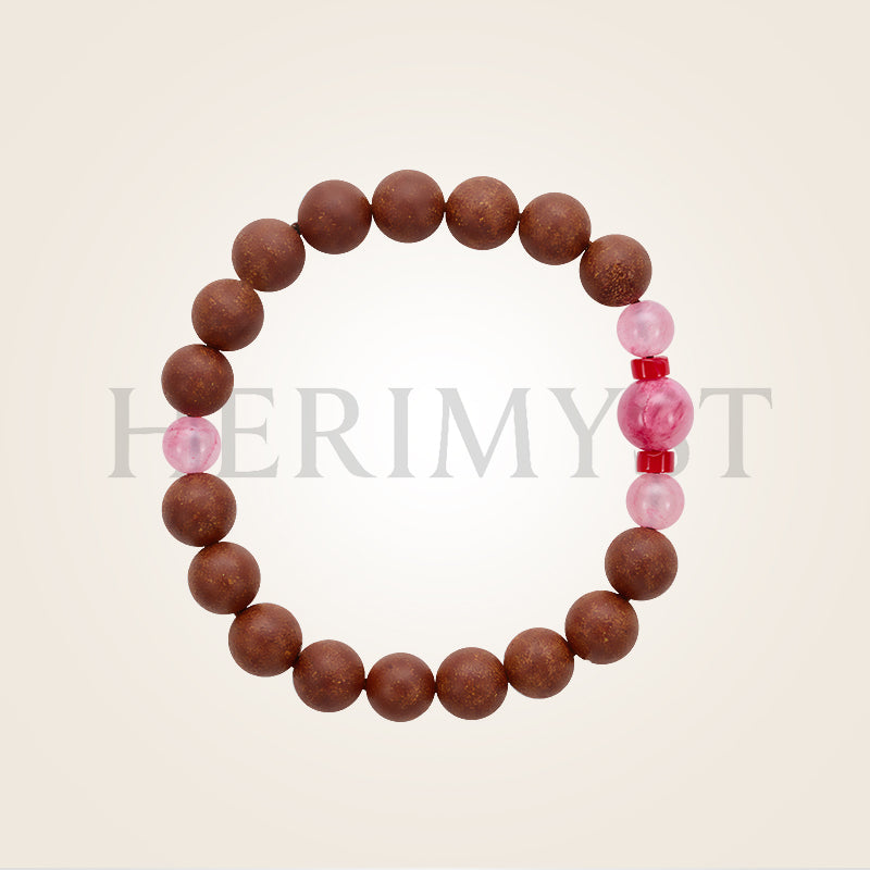 Incense bead bracelet featuring round wooden incense beads accented with pink gemstone beads, arranged in a minimalist oval layout on a light background.