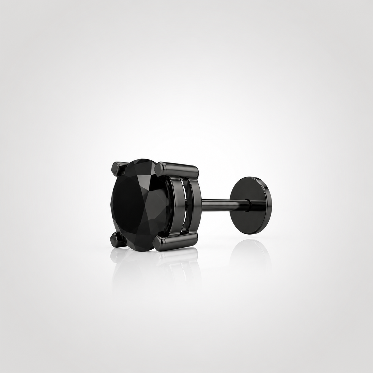 Side view of a natural black diamond stud showing geometric square prongs, post and flat disc earring back