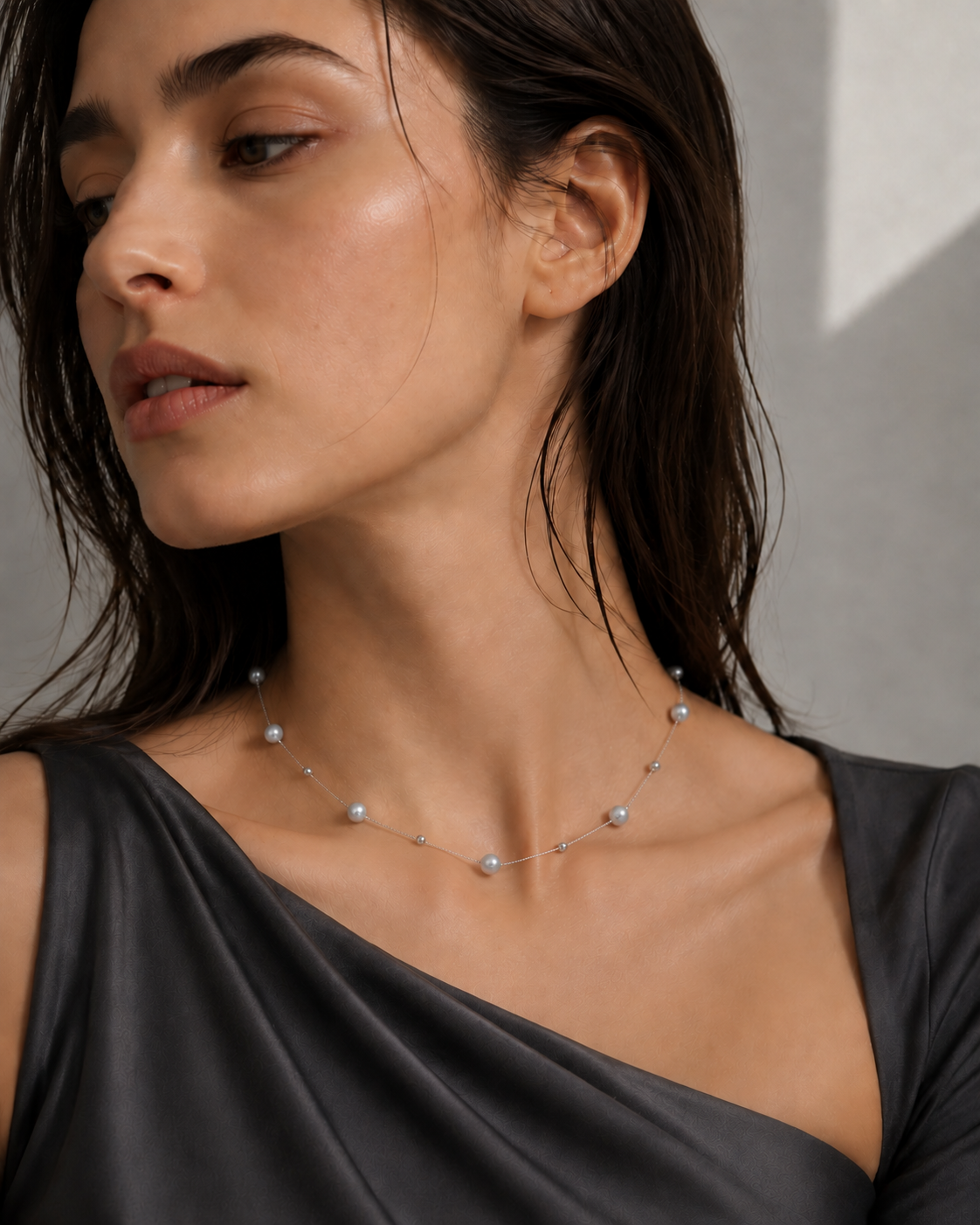 Model wearing a silver-blue Akoya cultured pearl station necklace with S925 sterling silver accents