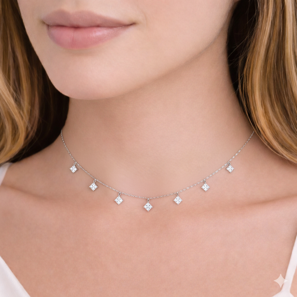 Model wearing a delicate seven princess-cut lab-grown diamond station necklace, 0.3 carat each diamond, evenly spaced on a fine white gold chain
