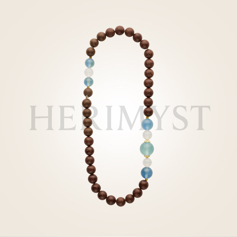 Herimyst Piān Wǔ incense bead bracelet from the Grace & Ritual Collection, 8 mm double-loop handcrafted beads with fluorite and agate accents in a soft neutral setting.