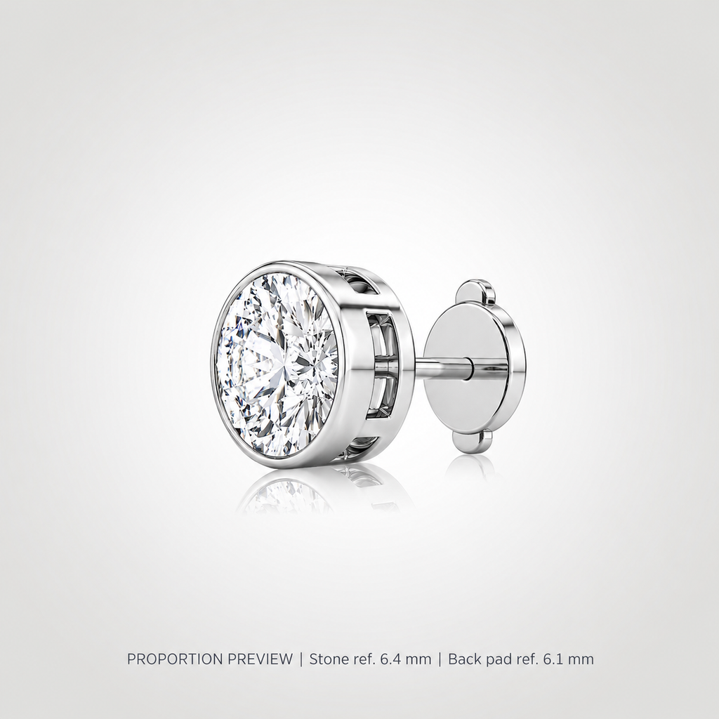 Proportion preview of a white gold bezel-set round diamond stud with a squeeze-release locking disc back; 1 ct reference, not measured product dimensions.