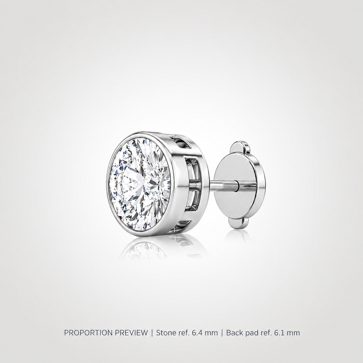 Proportion preview of a white gold bezel-set round diamond stud with a squeeze-release locking disc back; 1 ct reference, not measured product dimensions.