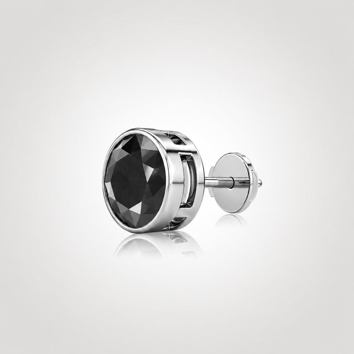 Natural black diamond stud in 14K white gold with a bezel setting and Guardian Back, shown from an angled side view.