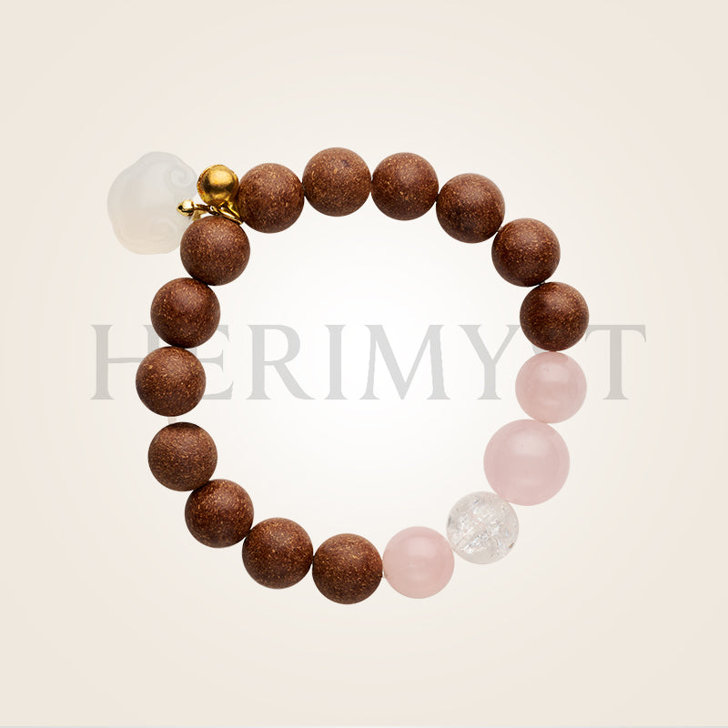 Herimyst Jiāo Yán incense bead bracelet from the Grace & Ritual Collection, handcrafted beads with rose quartz and agate accents in a minimal, elegant setting.